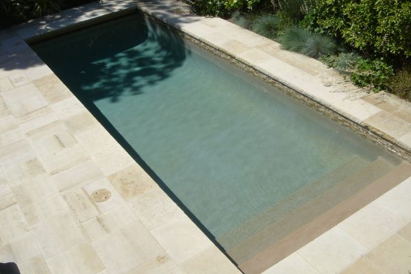 pool-with-beautiful-stone-tile-deck_riviera-pools-and-spas_premium-pool-builder-in-los-angeles-and-southern-california